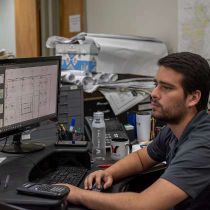 Foto de George F. Young de: A team member working on CADD